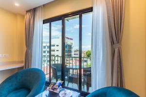 a room with a large window with a view of a city at Bhairahawa Garden Resort in Lumbini