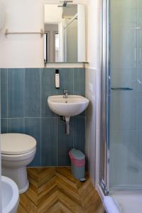 a bathroom with a sink and a toilet and a mirror at Pensione Silvia Santa Marì in Ponza +44 photos