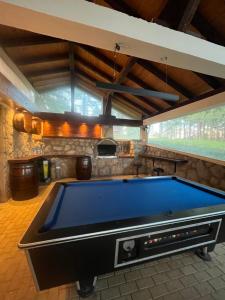 a pool table in a room with a ceiling at Guest House Colovic in Zlatibor