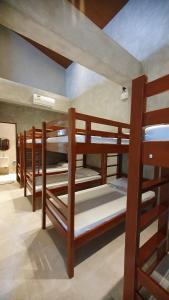 a group of bunk beds in a room at Dylan's Hot Spring in Los Baños +25 photos
