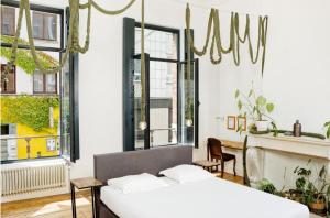 Un pat sau paturi într-o cameră la B&B DRUUM