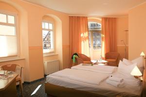 Postel nebo postele na pokoji v ubytování Hotel Wehlener Hof
