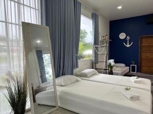 Ένα ή περισσότερα κρεβάτια σε δωμάτιο στο Napa Homestay