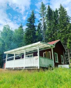 a small house in the middle of a field at The Secret Cabin 