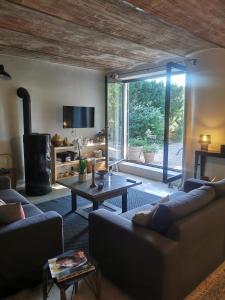 Χώρος καθιστικού στο Le Provençal Duplex piscine jardin le Luberon