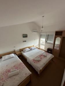 Ένα ή περισσότερα κρεβάτια σε δωμάτιο στο Atlantic-Moj market