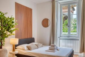 Postel nebo postele na pokoji v ubytování Le Dock Lodge - Studio - proche quai de Saone