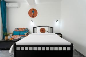 Postel nebo postele na pokoji v ubytování Mangshi Dianshan Xiyuan Homestay