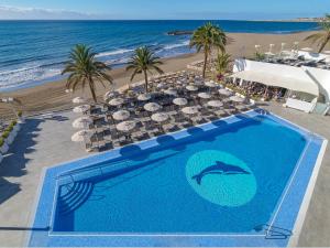 an overhead view of a swimming pool next to the beach at Don Gregory by Dunas - Adults Only in San Agustin