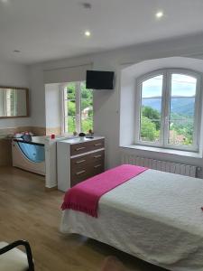 Postel nebo postele na pokoji v ubytování El Refugio Alojamiento Rural