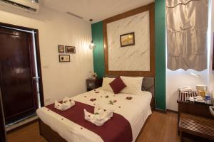 Postel nebo postele na pokoji v ubytování NT Elysian hotel