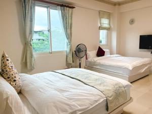 Postel nebo postele na pokoji v ubytování 花蓮統一的家民宿The home place