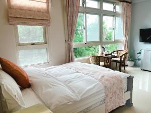 Postel nebo postele na pokoji v ubytování 花蓮統一的家民宿The home place