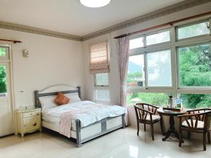 Postel nebo postele na pokoji v ubytování 花蓮統一的家民宿The home place