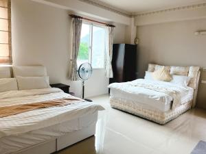 Postel nebo postele na pokoji v ubytování 花蓮統一的家民宿The home place