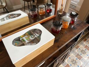 a wooden table with a box with a picture of a cross at Au charme de Rilly in Rilly-la-Montagne