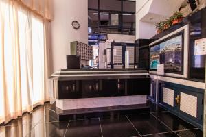 a room with a cashier counter in a store at Servatur JB - Adults Only in Puerto Rico de Gran Canaria
