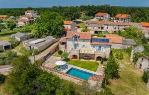 an aerial view of a house with a swimming pool at Villa Lamija by Villsy in Krmenjak