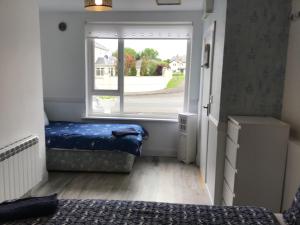 Letto o letti in una camera di Divine Mercy B&B
