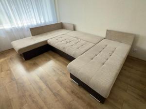 a living room with two beds and a couch at Soldino Apartments in Narva