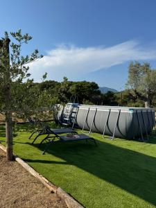 a playground with a slide in a park at Ca l'Esclatat in Santa María de Palautordera