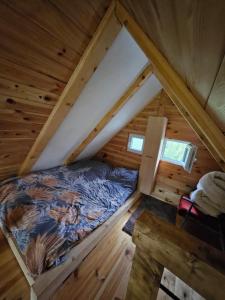 Una cama o camas en una habitación de Chalet Wood Magic