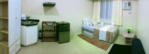 a hospital room with a bed and a sink at The Suite Pod I CDO CondoStaycation - U23 in Cagayan de Oro