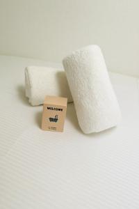 a pile of toilet paper next to a roll of toilet paper at The Lafayette Charm & Practicality in the heart of Lyon in Lyon