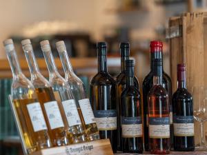 a group of wine bottles sitting on a table at Hotel Mediterra in Uhldingen-Mühlhofen +26 photos