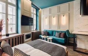 a bedroom with a bed and a couch at 3 - Casa Botticella - DonViore in Győr