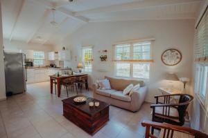 a living room with a couch and a table at Dushi Boho in Willemstad