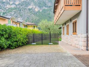a gate on the side of a building at Apartment Calicantus by Interhome in Dro +27 photos