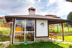 a small house with a gazebo at Cozy Villa Retreat in Cigov Chark in Tsigov Chark
