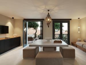 a living room with a table and a couch at The Chedi El Gouna in Hurghada