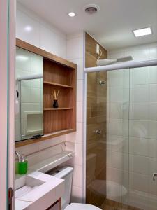 a bathroom with a shower and a sink and a toilet at Studio 11 Refugio Relaxante Mogi in Mogi das Cruzes +69 photos