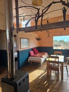 a living room with a couch and a table at Casa Ko in La Ensenada