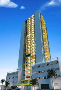 a tall building with palm trees in front of it at Studio 11 Refugio Relaxante Mogi in Mogi das Cruzes
