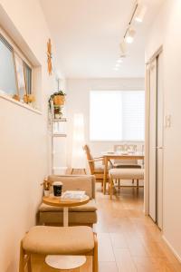a living room with chairs and a table at First Choice Minami Kamata in Tokyo