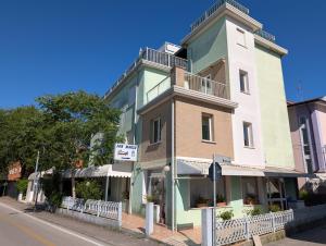 a building on the corner of a street at Alloggi San Marco in Caorle