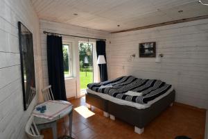 Postel nebo postele na pokoji v ubytování Kolarbo Gård B&B