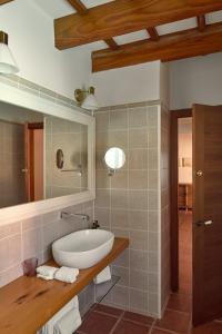 a bathroom with a sink and a mirror at Son Granot Hotel Rural in Es Castell +50 photos