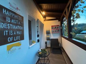 a room with a table and a sign on the wall at Kleiner Kalle in Melsungen