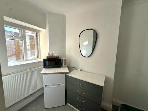 a bathroom with a sink and a mirror on the wall at Elohim Double Room in London +40 photos