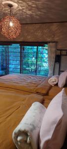 Ein Bett oder Betten in einem Zimmer der Unterkunft Atami Ikyuan 熱海一休庵