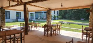 a group of tables and chairs in a pavilion at Tilia Kvareli Resort in Kvareli