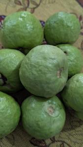 a group of green limes sitting on a table at Peace in city, home of greenary Grand Journey Venue in Darbhanga