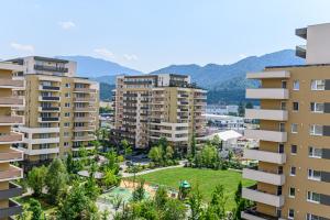 an aerial view of buildings in a city at Mountain Views Urban Plaza in Braşov