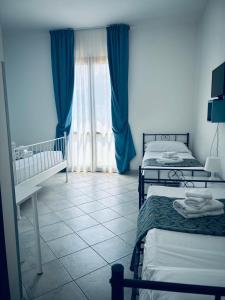 Postel nebo postele na pokoji v ubytování Hotel Achibea