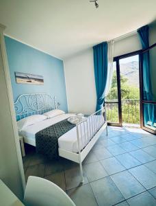 Postel nebo postele na pokoji v ubytování Hotel Achibea