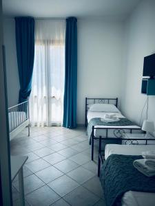 Postel nebo postele na pokoji v ubytování Hotel Achibea